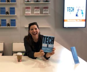 photo of Kate O'Neill with copy of Tech Humanist book